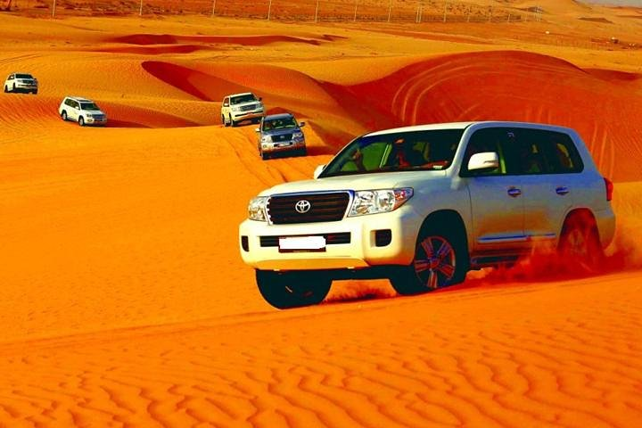 Experience the thrill of dune bashing in a 4WD across stunning desert landscapes creating unforgettable memories under the stars while enjoying traditional entertainment and cuisine.